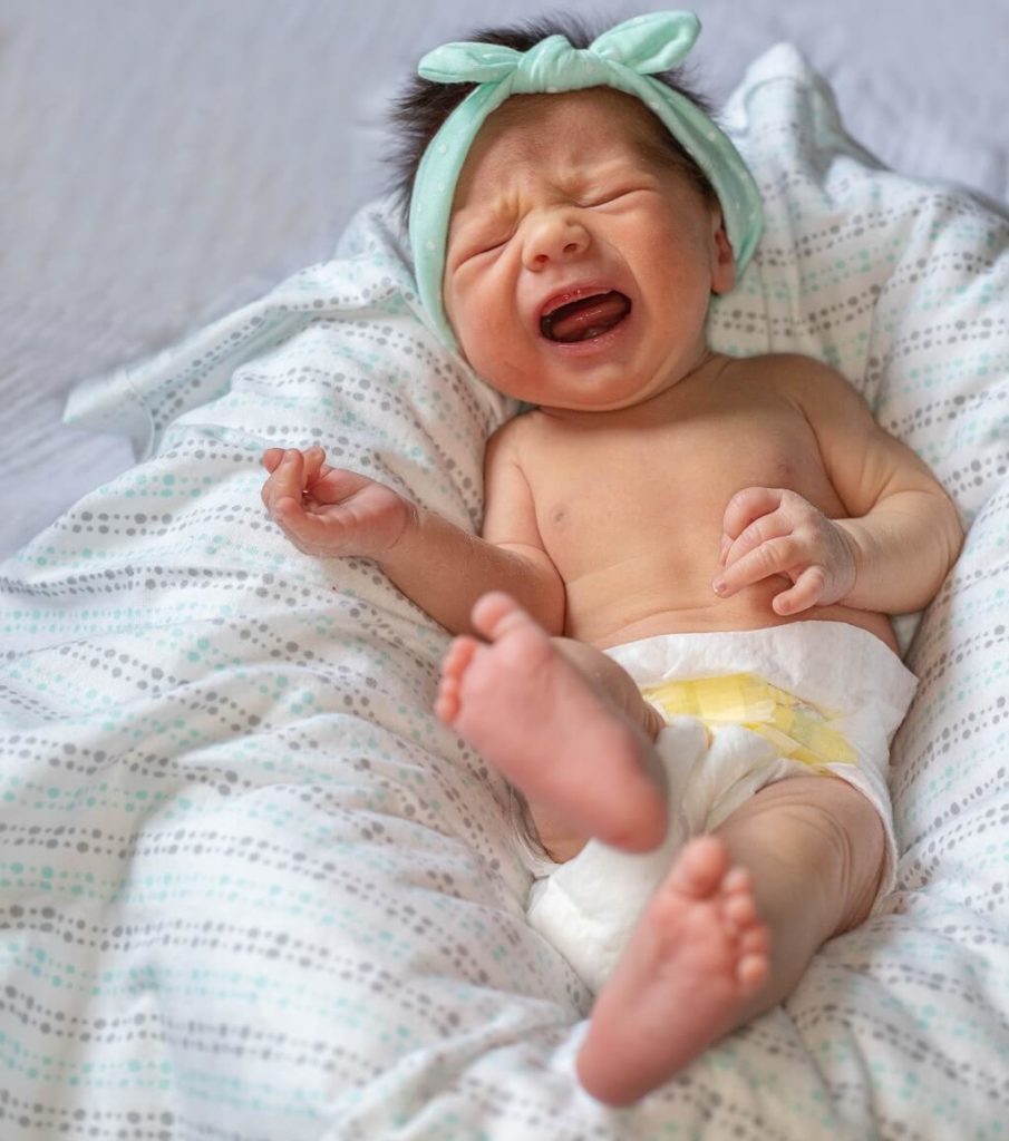 Photo shows a newborn baby, mouth wide open and eyes clenched, crying hard and painfully and depicts a difficult relationship for a mother. You want a partner that has acheived a positive relationship with their mother.